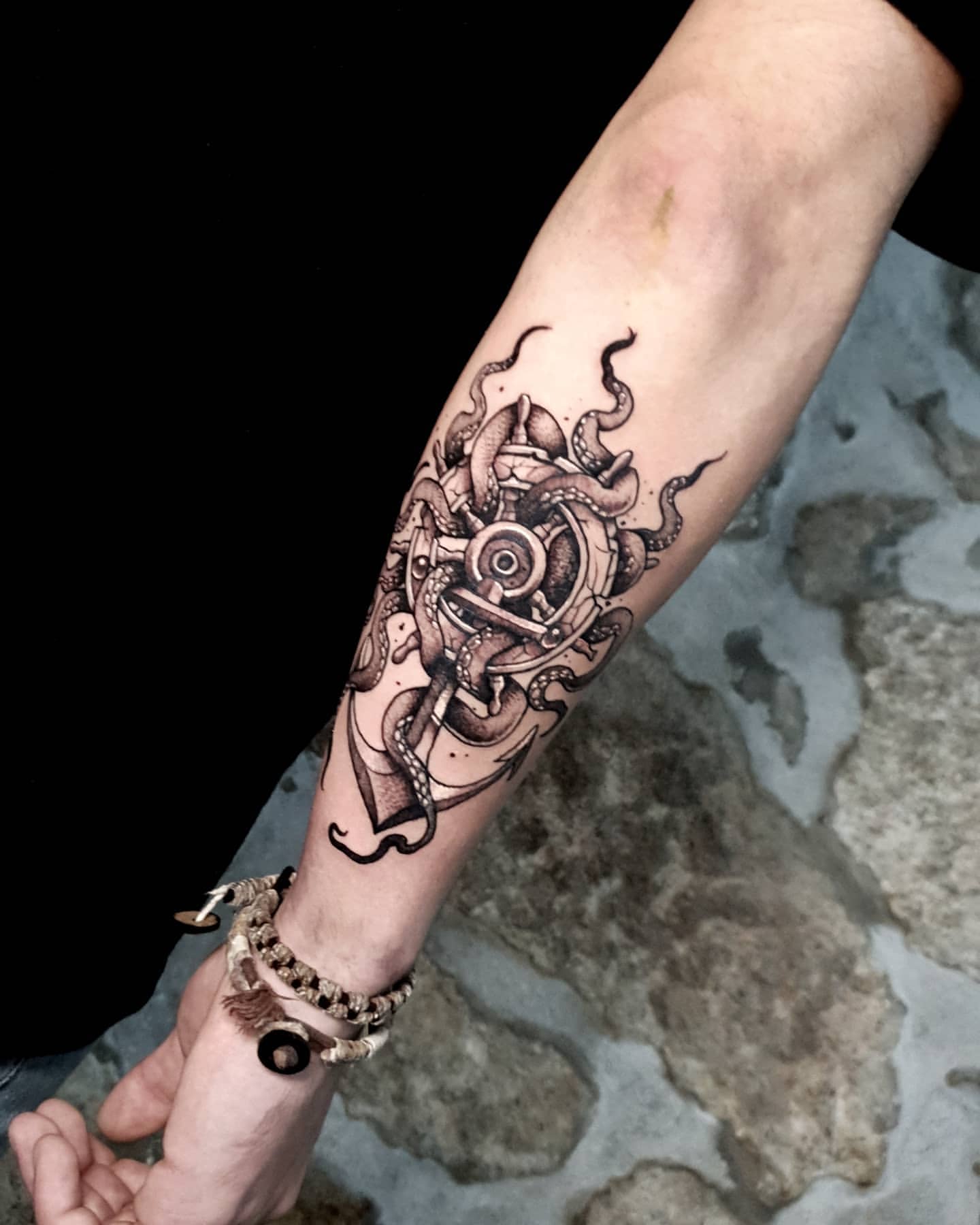 Octopus and nautical anchor blackwork tattoo on forearm by Lex Almeida